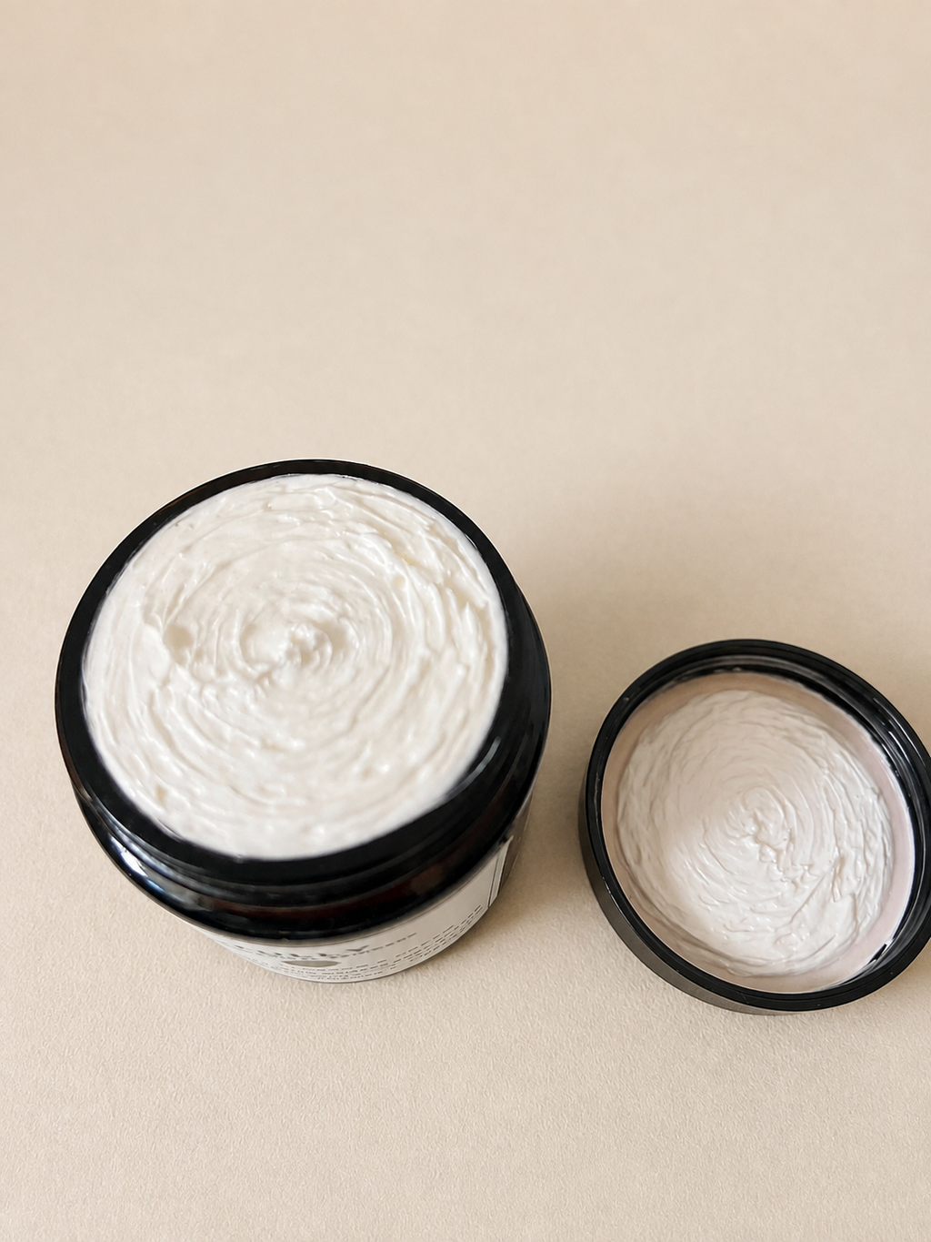 Open jar of Tully Botanical Radiant Body Soufflé showing its rich whipped waterless body butter texture